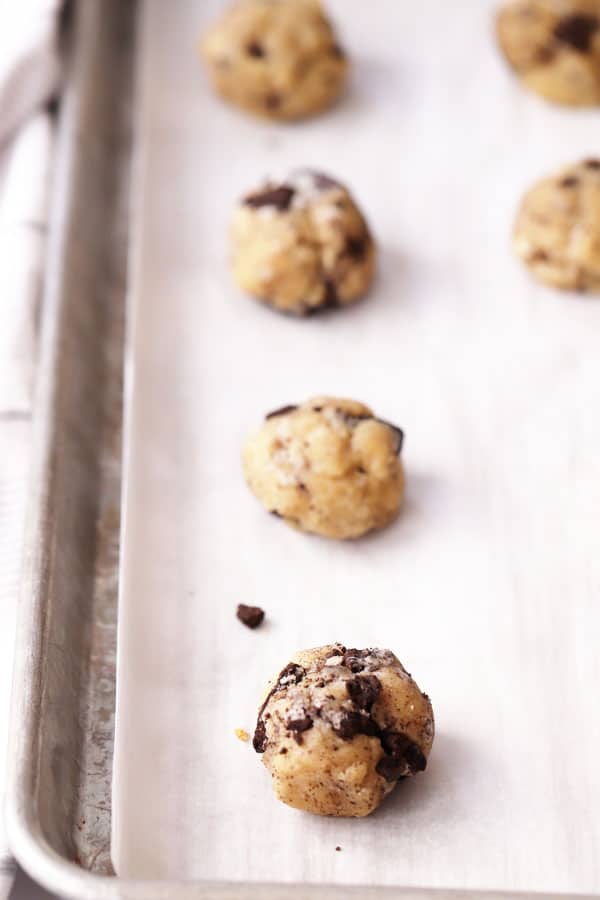 crushed oreo cookie dough on parchment paper