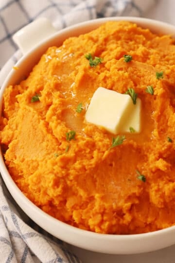 mashed sweet potatoes in a large white bowl
