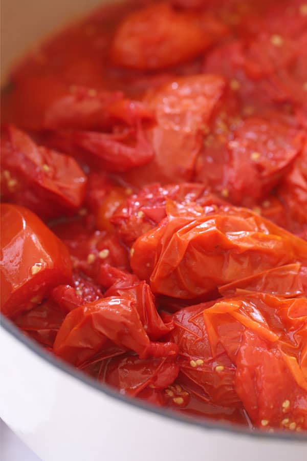 Roasted tomatoes in a large pot.