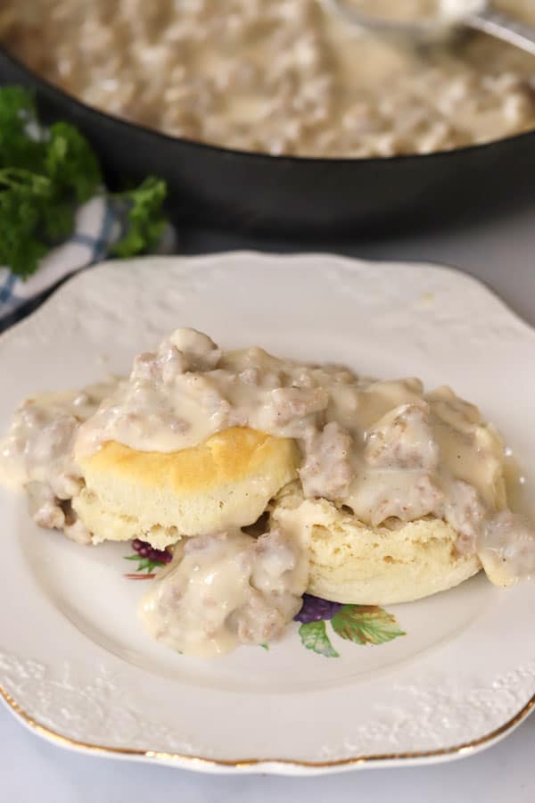 sausage gravy on top of homemade biscuits, best sausage gravy with biscuits recipe. 