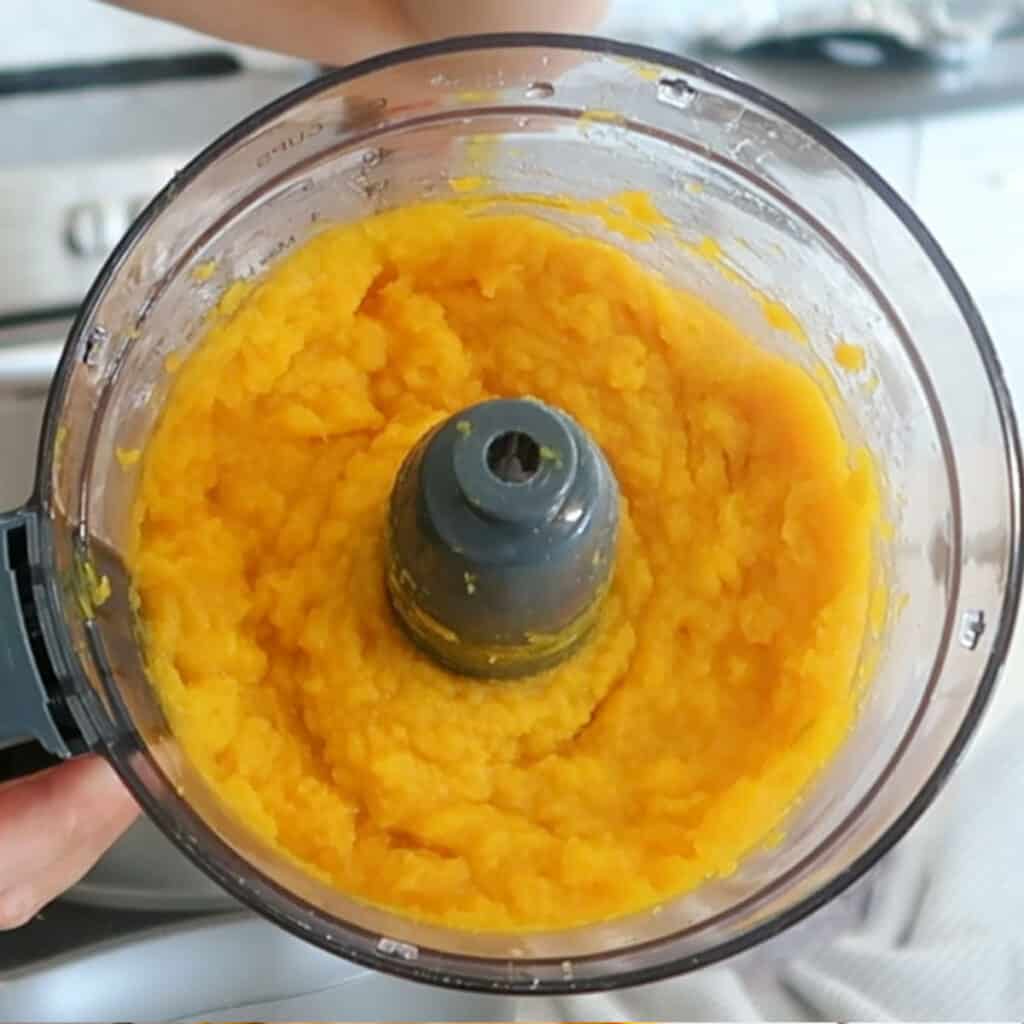 Homemade pumpkin puree in a food processor.