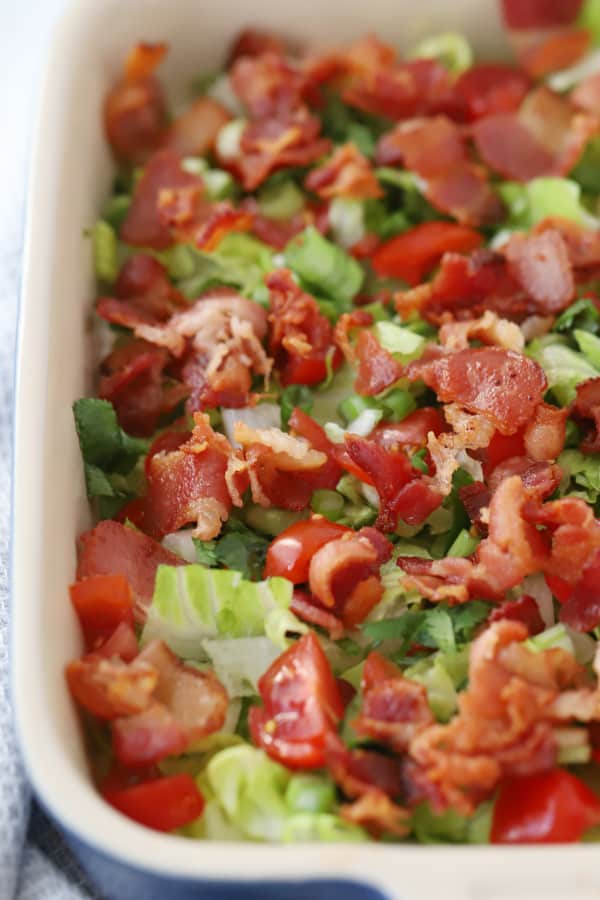 BLT dip in a glass baking dish.
