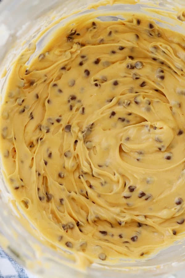 buckeye dip in a mixing bowl with mini chocolate chips