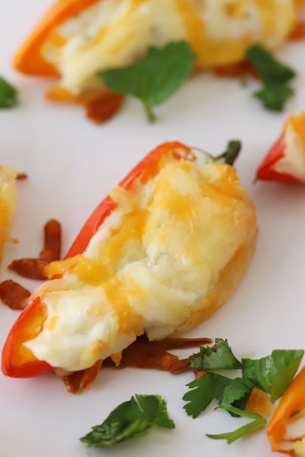 Cheese stuffed peppers on a serving platter.