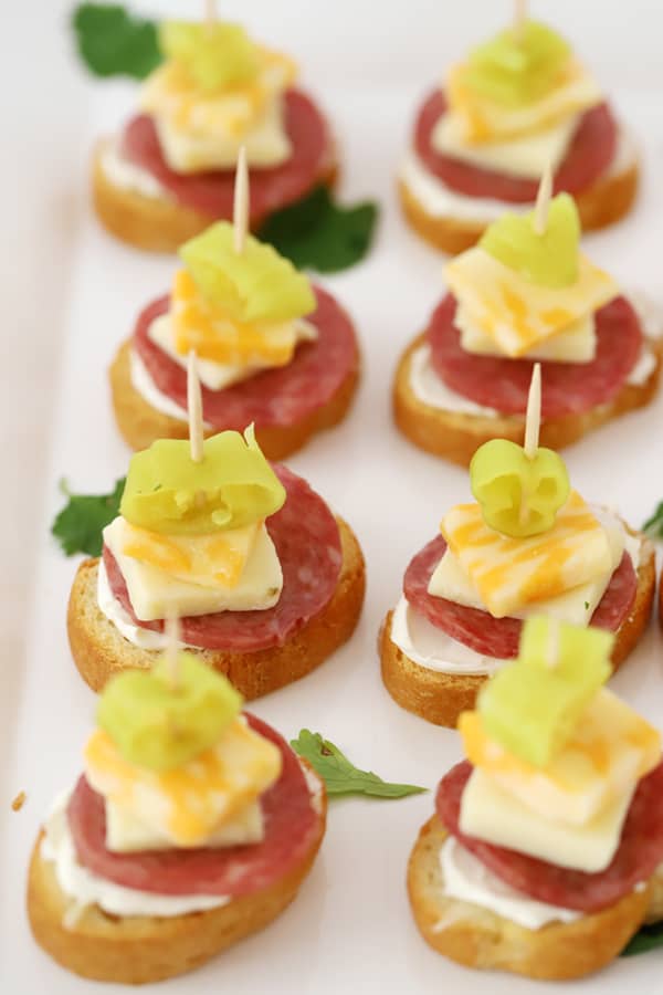 Italian mini kabobs with toothpicks on a serving platter.