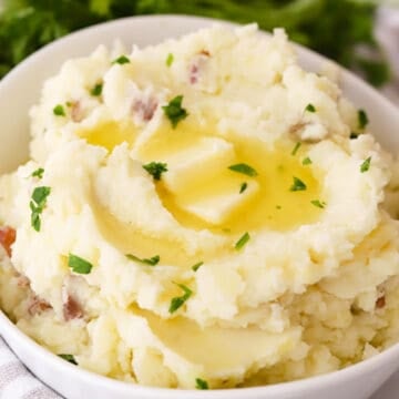 mashed red potatoes in a large white bowl, ready to be served, best mashed potatoes
