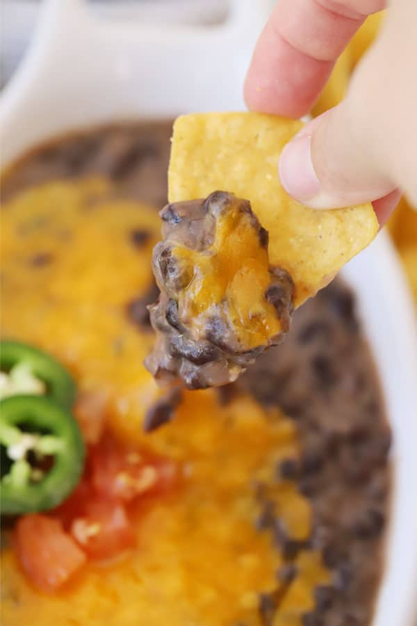 refried black beans on a tortilla chip
