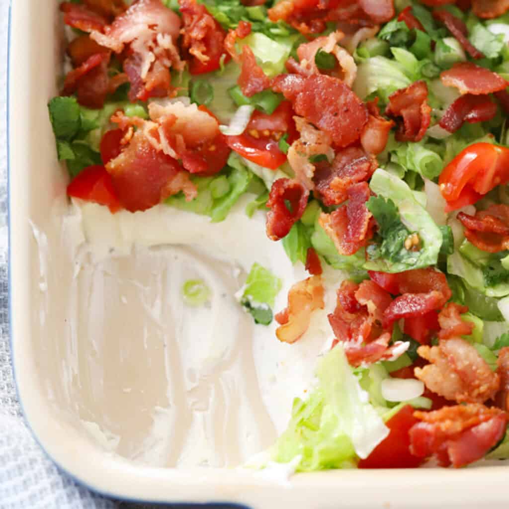 blt dip with bacon on top, an easy bacon appetizer