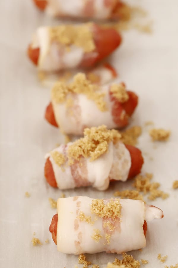 bacon wrapped smokies with brown sugar on top