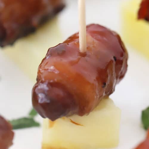bacon wrapped smokies on pineapple