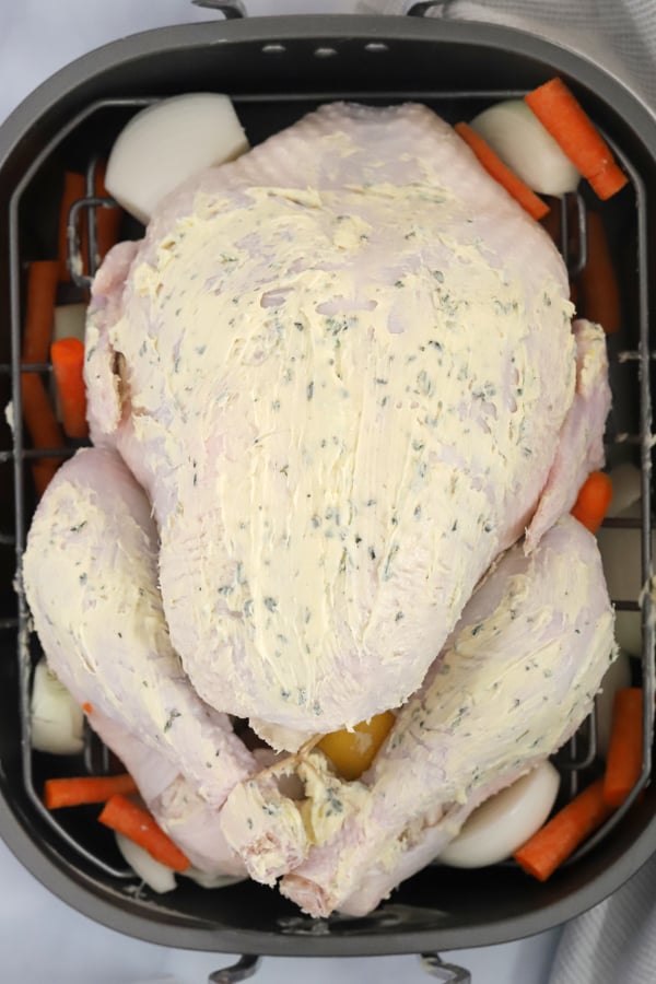 seasoned whole turkey, ready to be roasted for thanksgiving