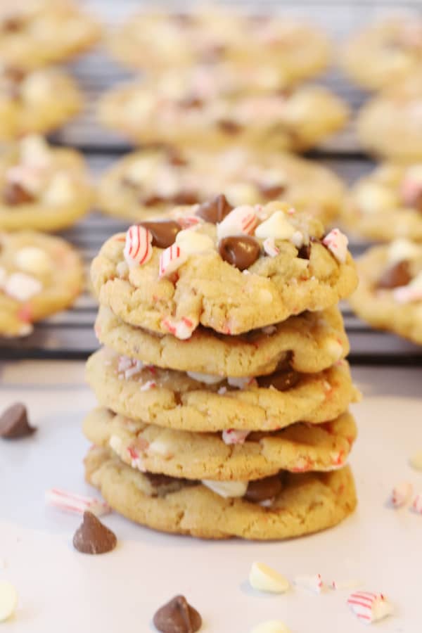 chocolate chip peppermint cookies, stacked on top of each other.  Thick and chewy homemade cookies, chocolate peppermint chip cookies.