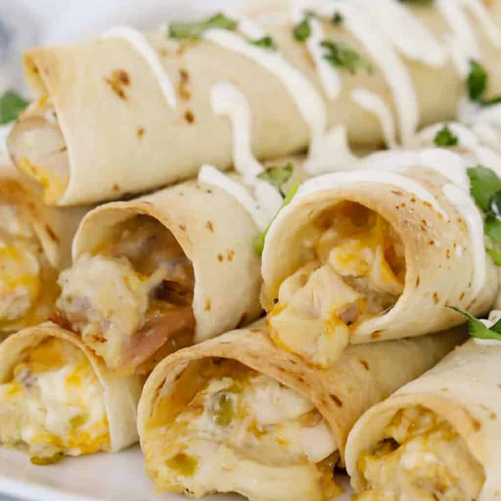 homemade chicken taquitos with green chili, an easy football party food.