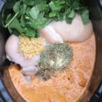 easy slow cooker tuscan chicken ingredients in a crockpot