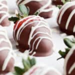 chocolate dipped strawberries on a white serving tray