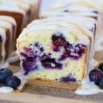 blueberry mini loaves on a wood cutting board