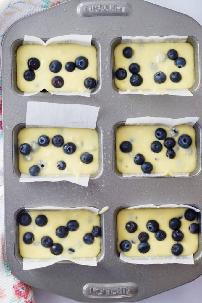 blueberry mini loaves in a pan, ready to bake