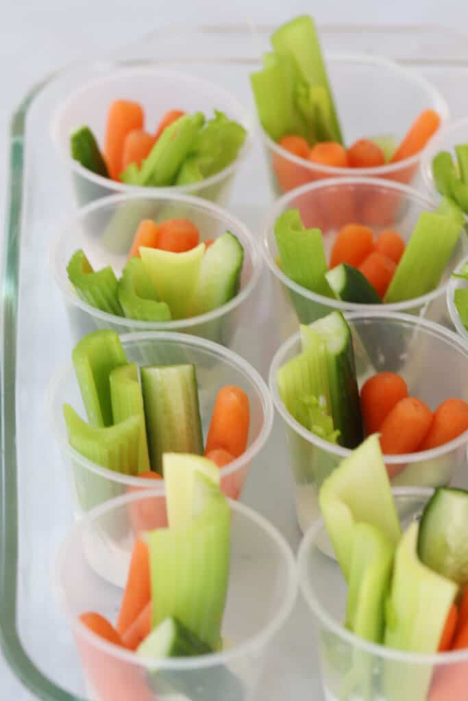 veggies and ranch in small cups with ranch dressing.