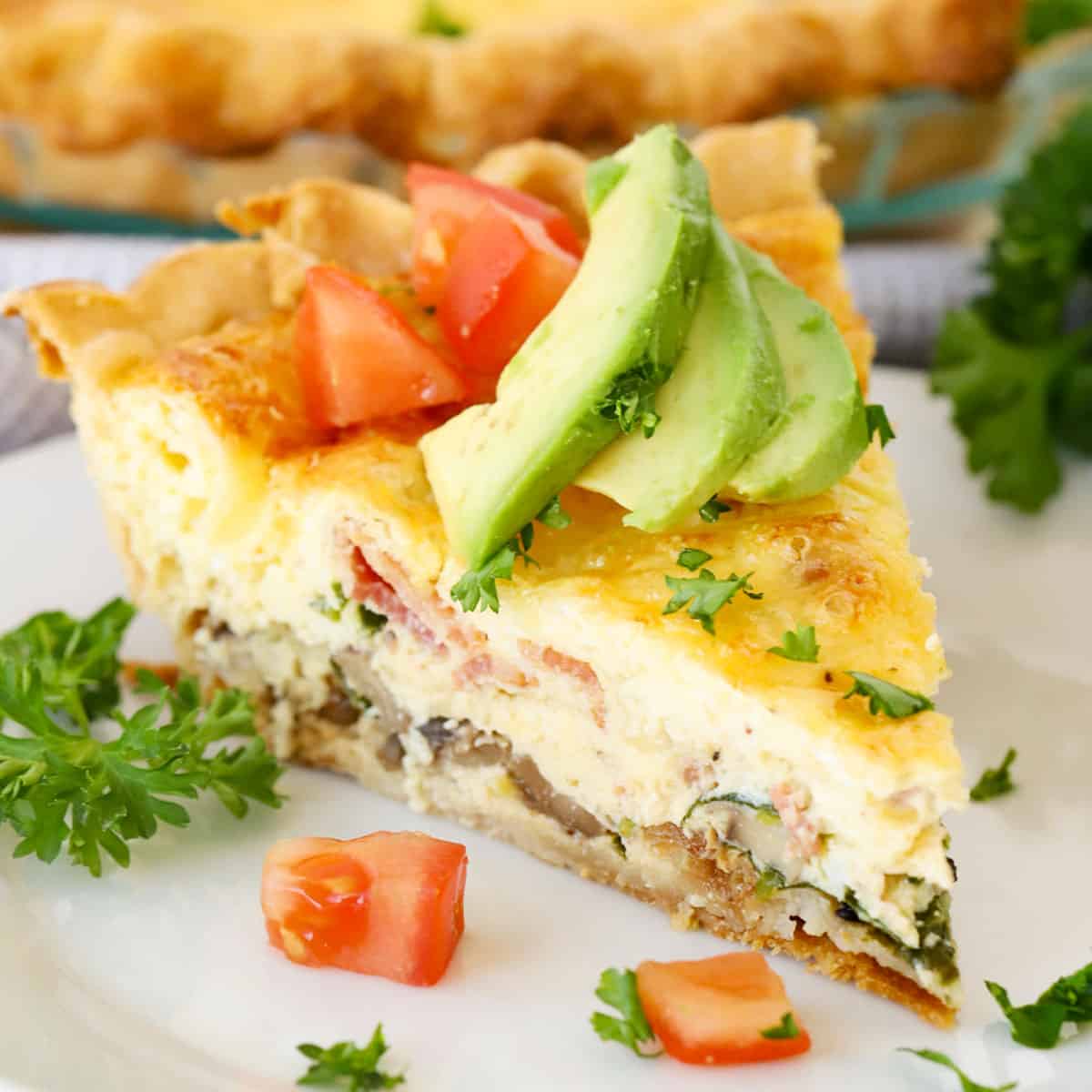 quiche recipe with avocado and tomatoes on top