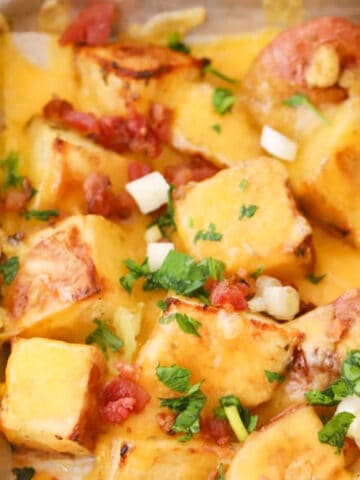 cheesy ranch potatoes on a baking sheet, cheesy bacon potatoes recipe