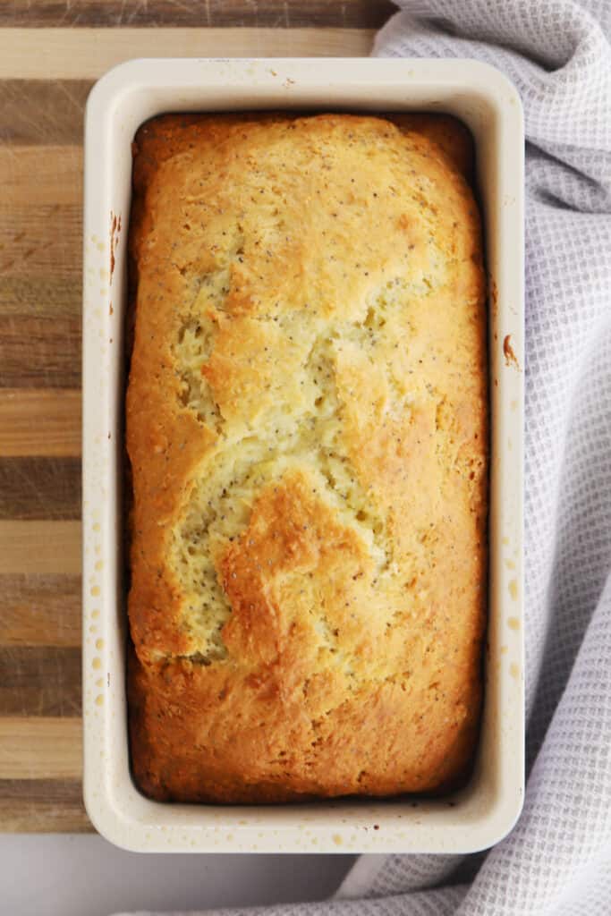 lemon poppy seed bread recipe in a loaf pan, poppy seed bread, lemon poppyseed loaf.