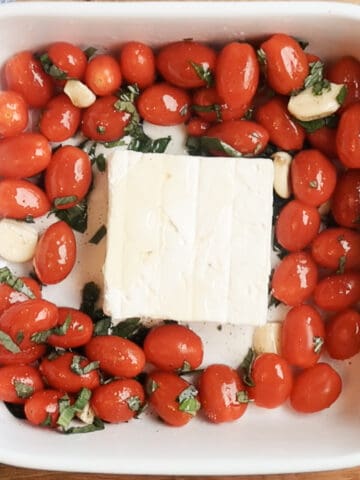 tortellini feta cheese pasta ingredients, ready to bake in a white baking dish, feta cheese pasta recipe