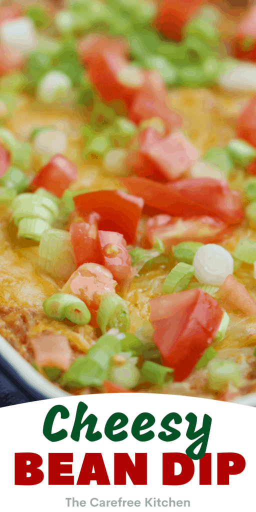 A white baking dish filled with cheesy bean dip.