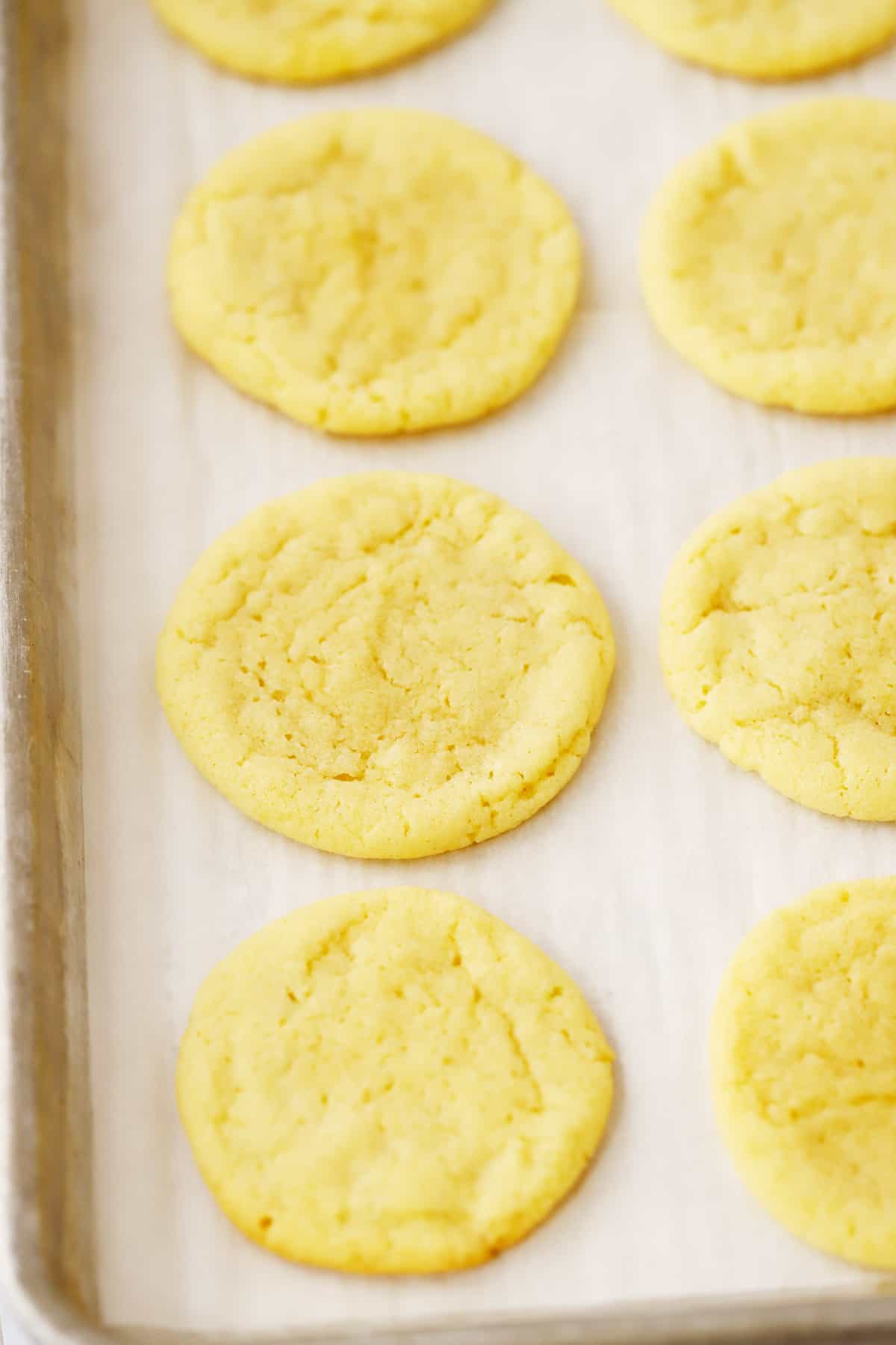 Baked lemon cookies on a baking sheet.