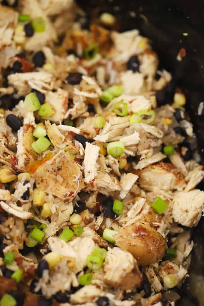 slow cooker full of chicken burrito bowl ingredients.
