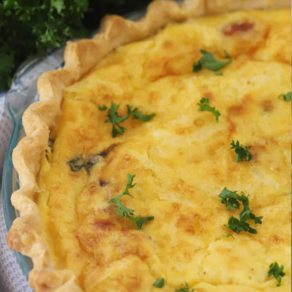 bacon asparagus Quiche on a plate, ready to be served warm or cold.