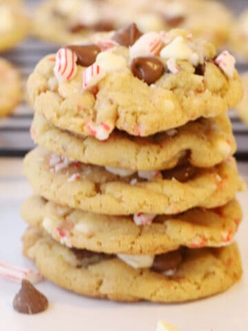 candy cane chocolate chip cookies on a white plate