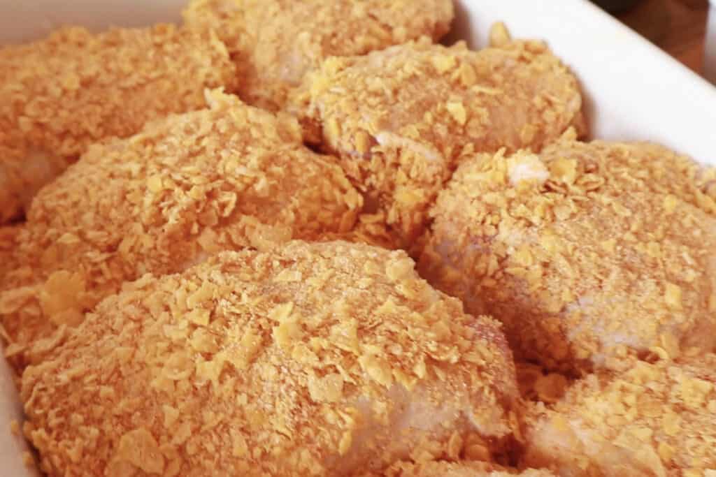 how to make baked cornflake chicken, corn flake chicken, best cornflake chicken thighs cornflake chicken recipe. 