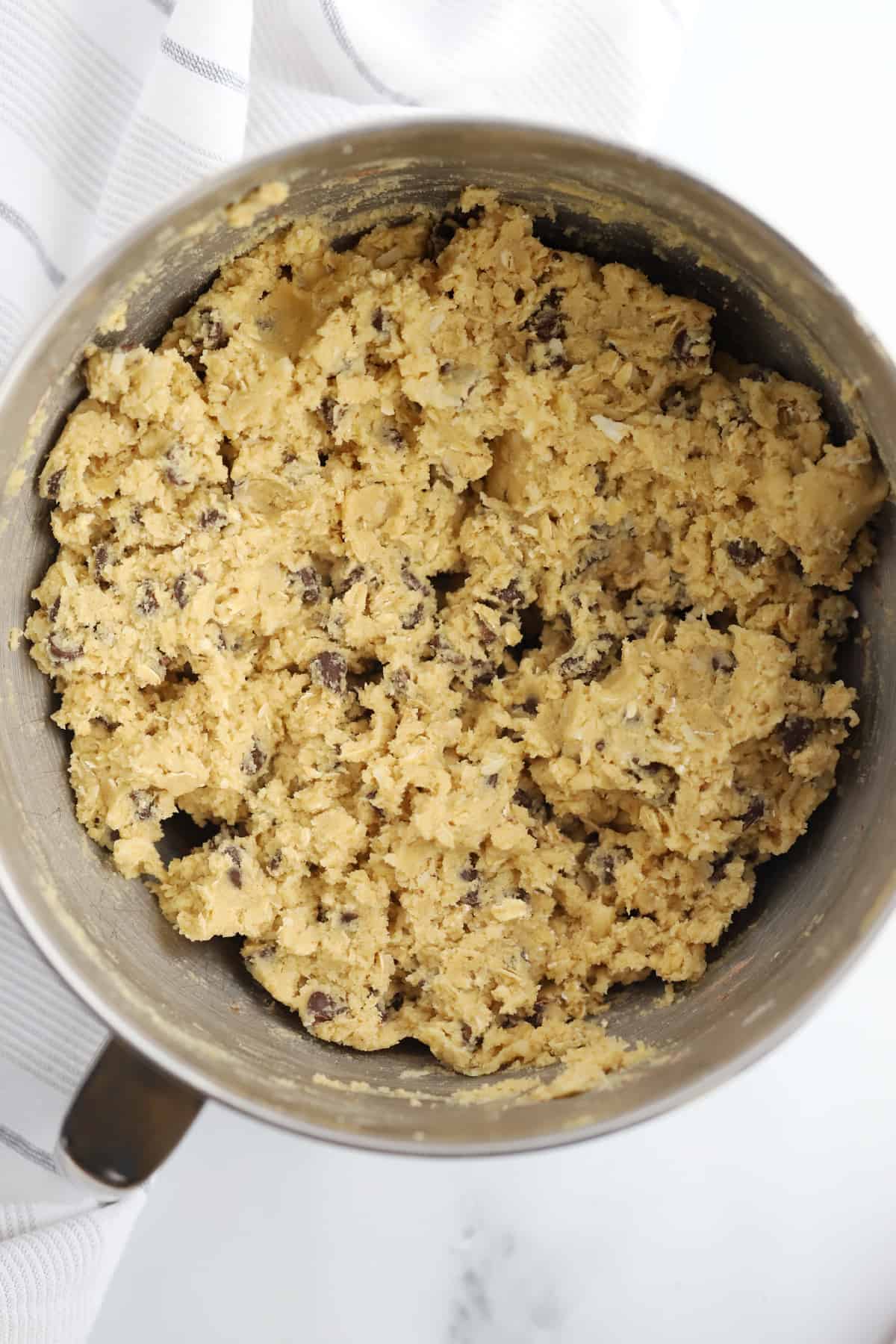 A mixing bowl full of cookie dough.