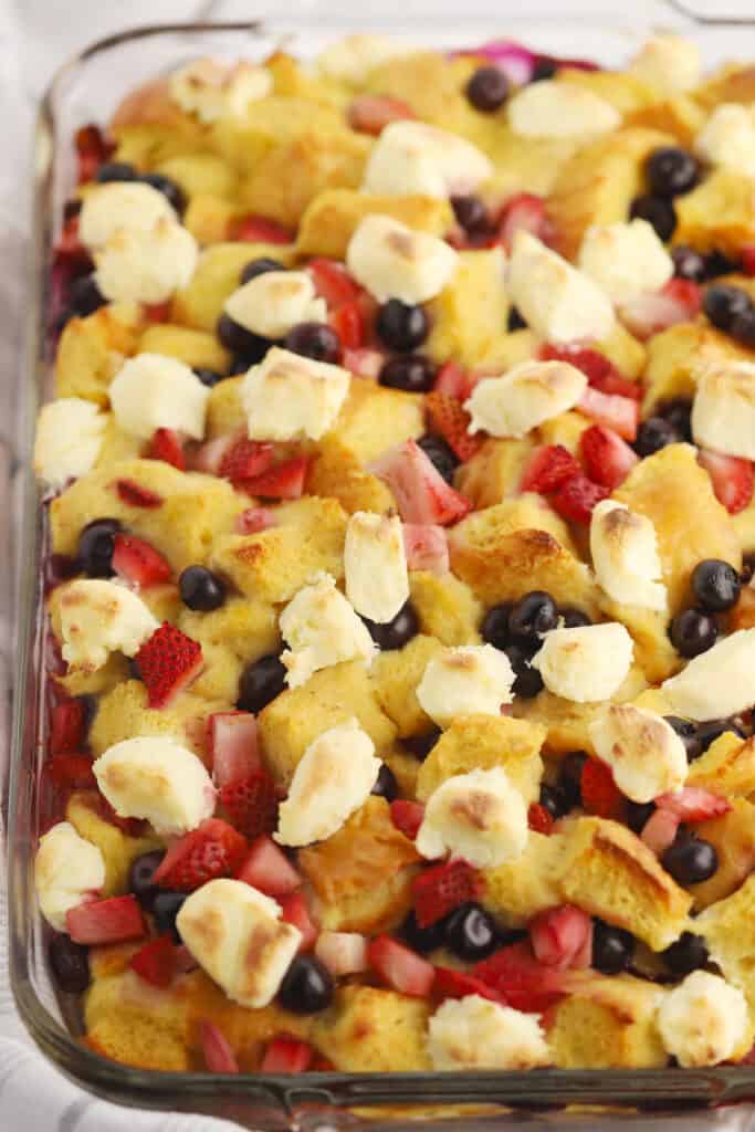 4th of july blueberry stuffed french toast casserole in a baking dish.