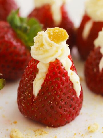Cheesecake stuffed strawberries with cookie crumbs on top
