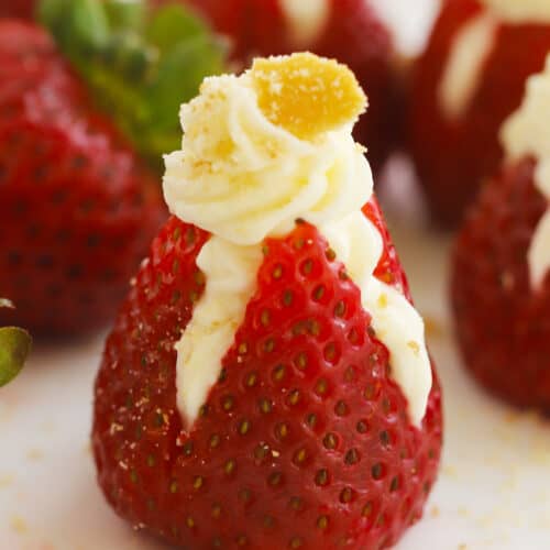 Cheesecake stuffed strawberries with cookie crumbs on top