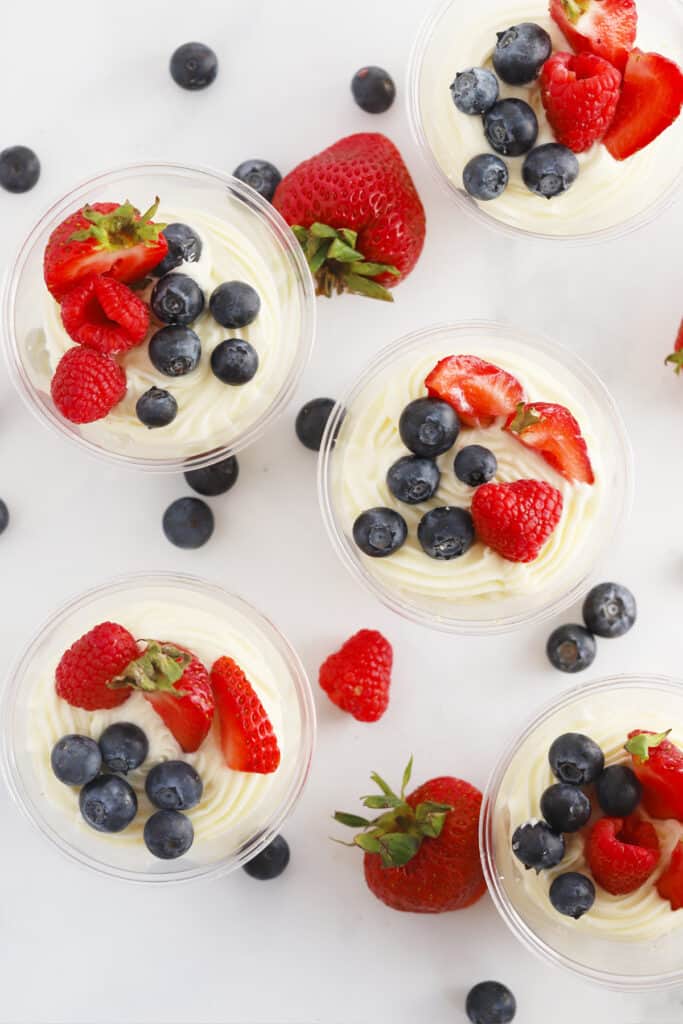how to make no bake mini cheesecakes in cups. These mini cheesecake cups are topped with fresh berries.