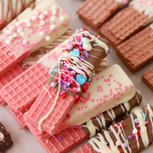 wafer cookies decorated for the holidays on parchment paper