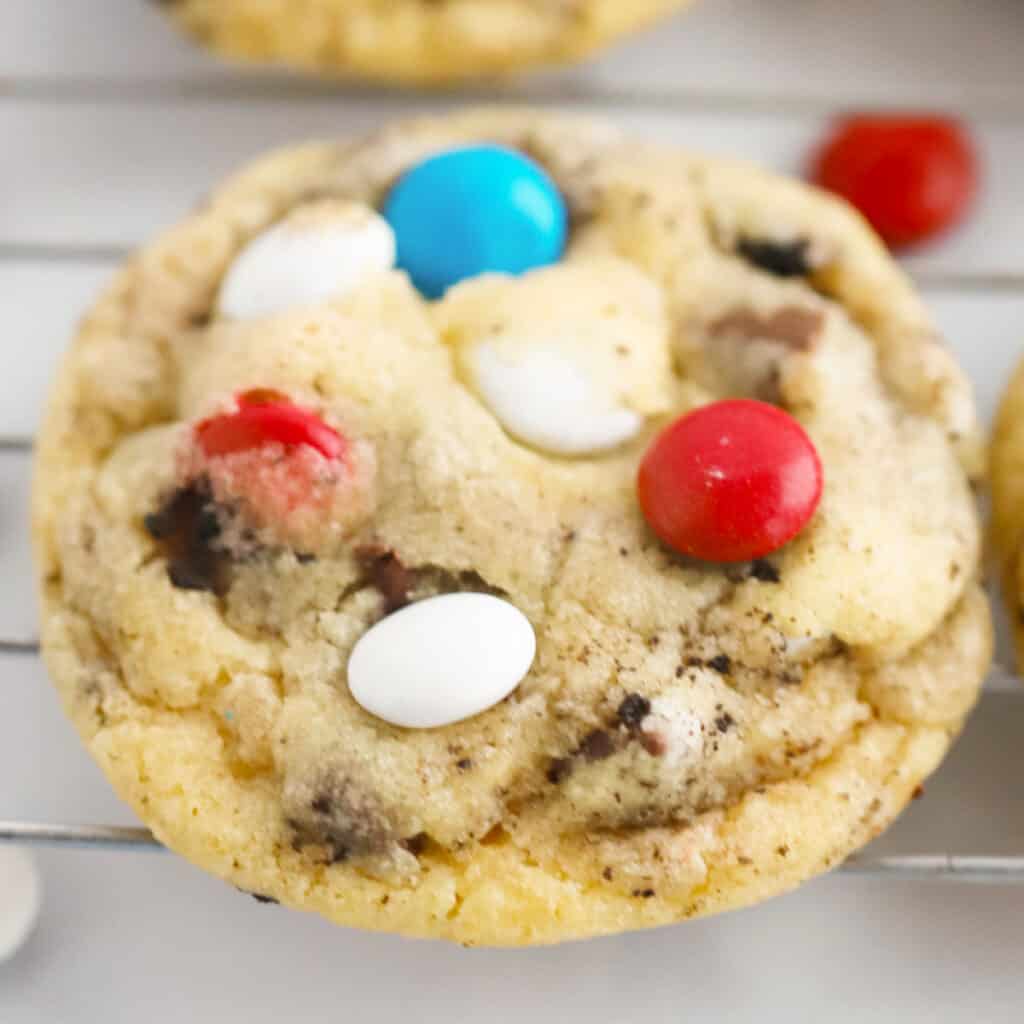 This cookies and cream cookie recipe fills each cookie with oreos, chocolate chips, and M&Ms. 
