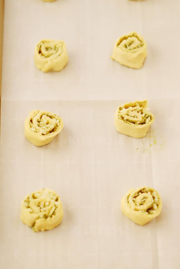 A tray of Pesto Pinwheels ready to put into the oven to bake. appetizers with pesto, pesto appetizer, crescent roll appetizer. 