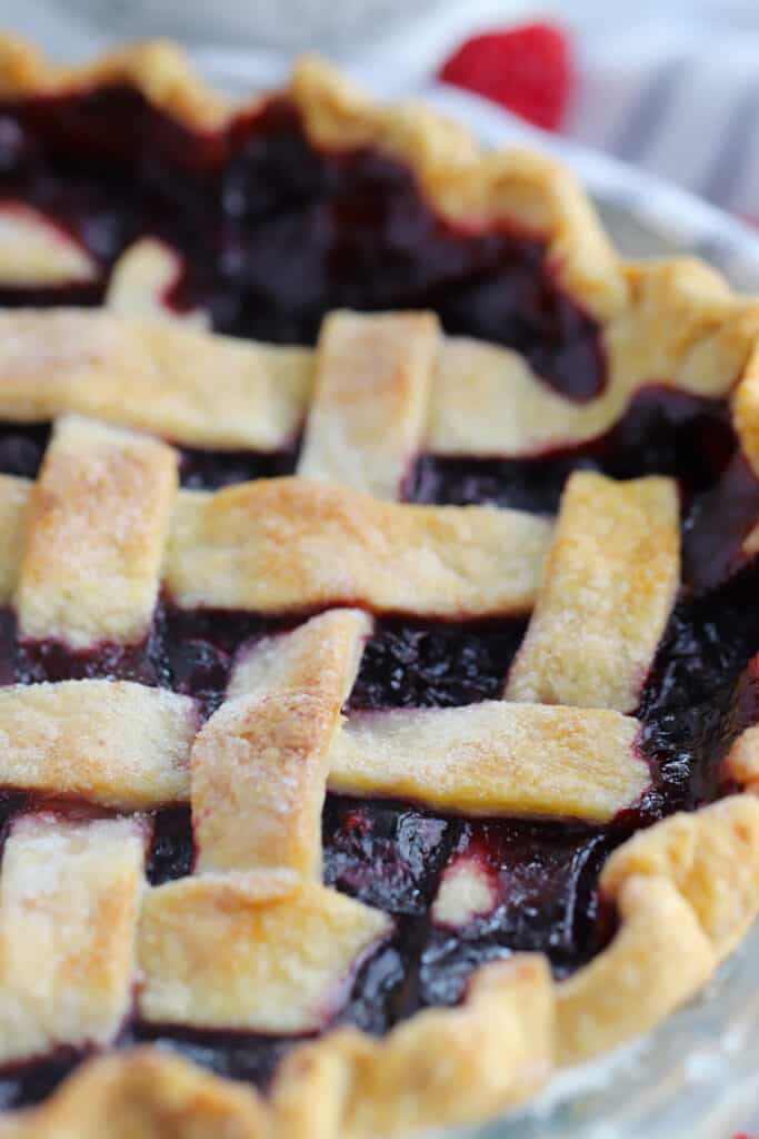 A close up picture of a freshly baked Razzleberry pie.