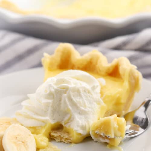 banana cream pie slice on a white plate