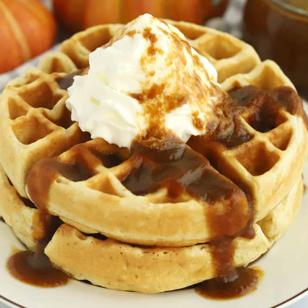 homemade pumpkin syrup on top of waffles.