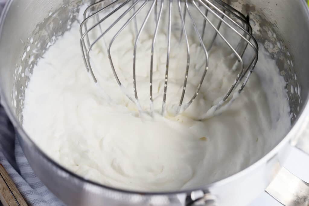 A mixing bowl full of fresh whipped cream. how to make whipping cream at home, diy whipped cream.