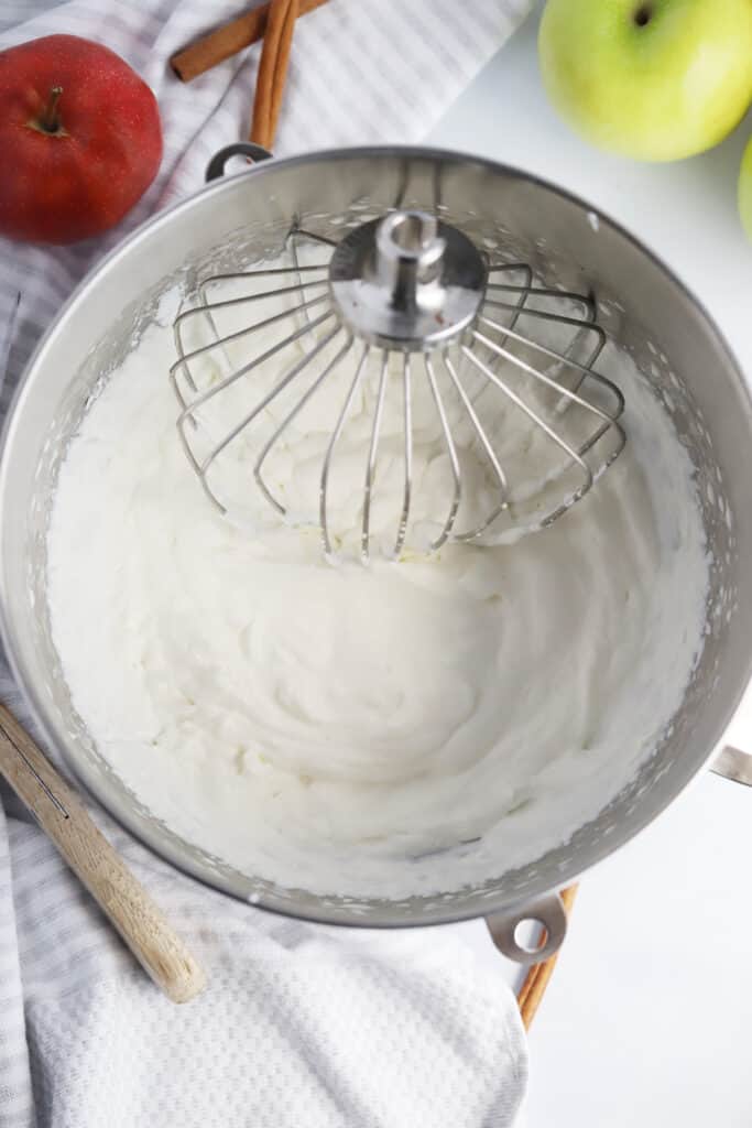 A mixing bowl full of fresh whipped cream. how to make whipped cream. sweetened whipping cream. 