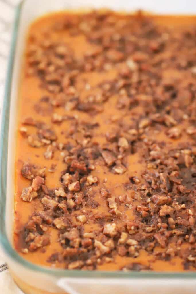 Pumpkin crunch recipe with walnut crunch topping baked into a baking dish, easy thanksgiving dessert recipe. 