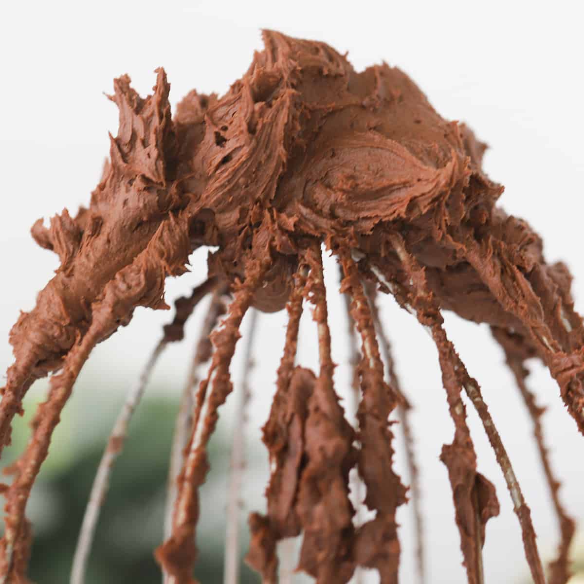 easy chocolate buttercream frosting on a wire wisk