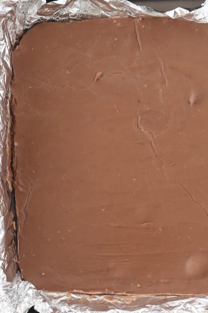 A pan full of chocolate fudge ready to cut.