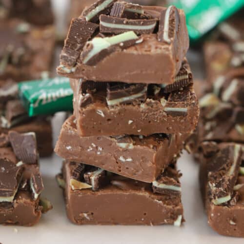 andes mint fudge stacked in a pile with mints around