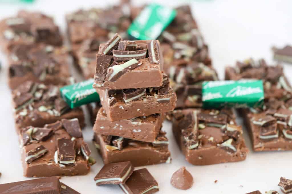 andes mint fudge on parchement paper, stacked in a pile